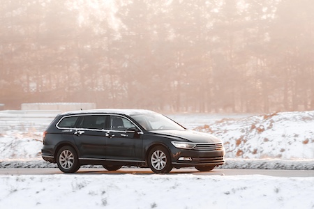 Car driving on a snowy Philadelphia street 